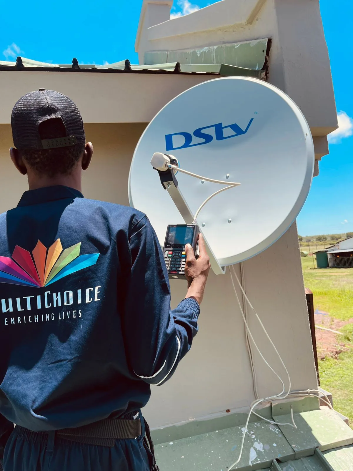 MultiChoice-accredited technician aligning a DSTV satellite dish