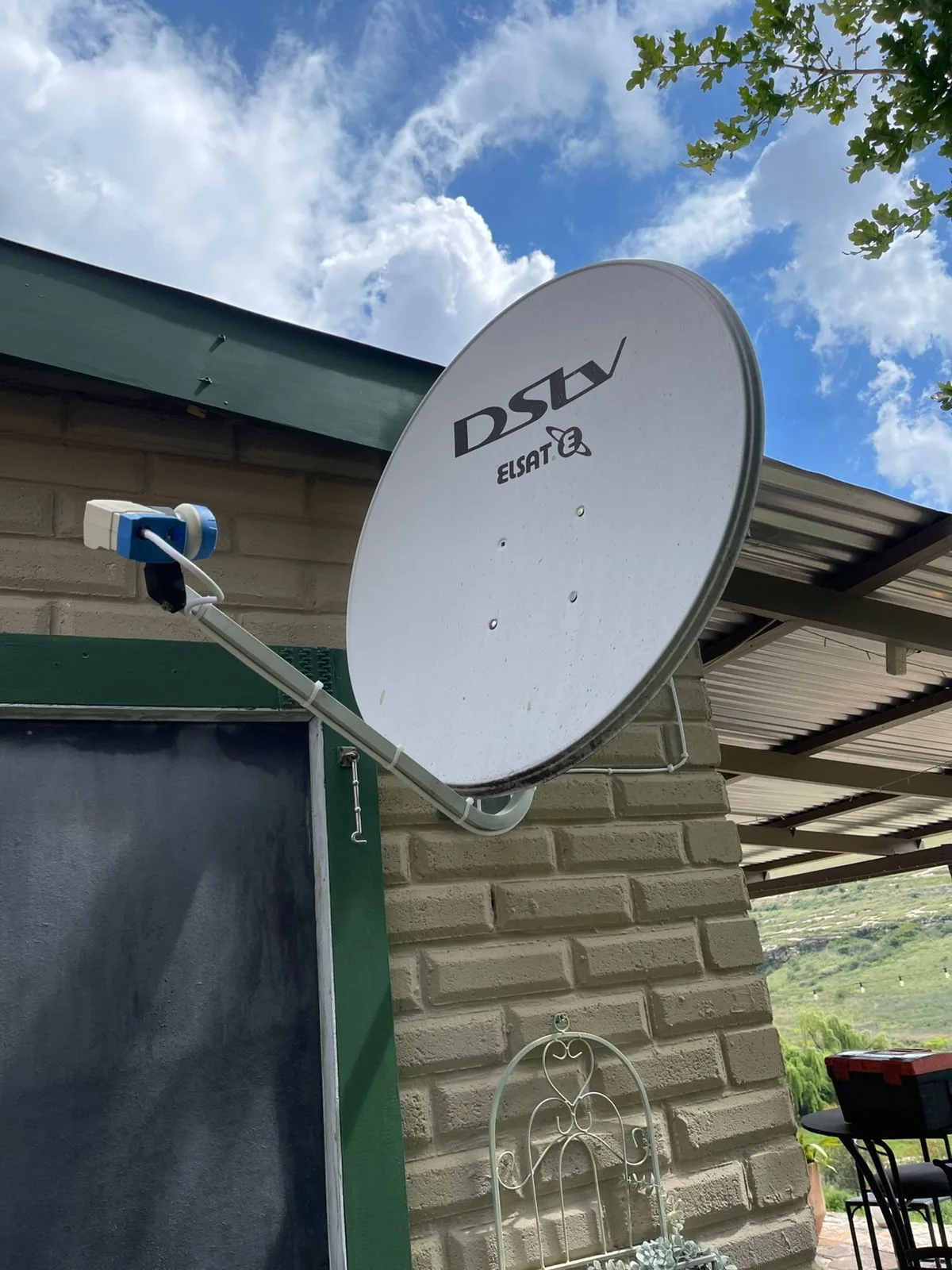 Elsat satellite dish fitted to a face-brick country home